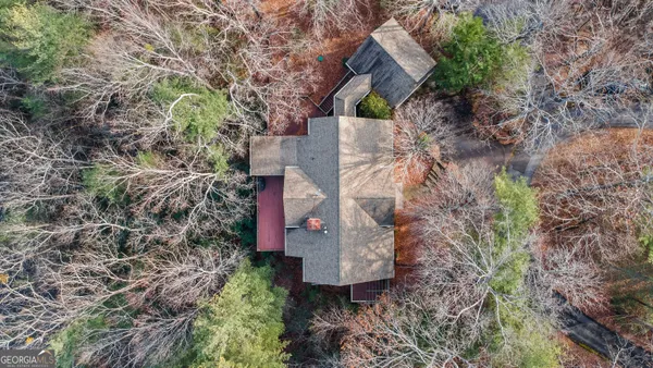 an aerial view of house with yard and mountain view