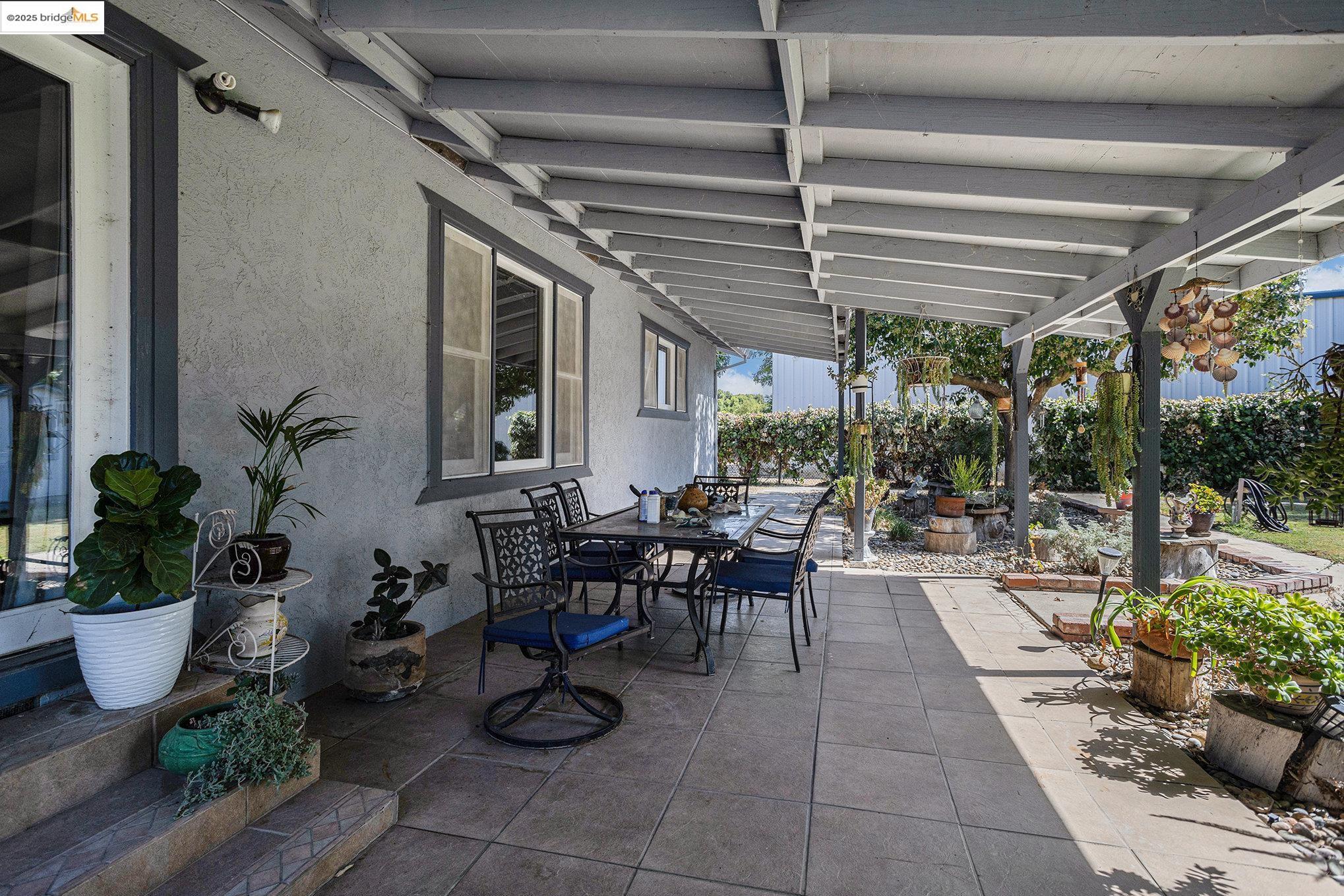 81 Yula Way Oakley, CA 94561 - Photo 9 of 44 a view of a patio with chairs and potted plants