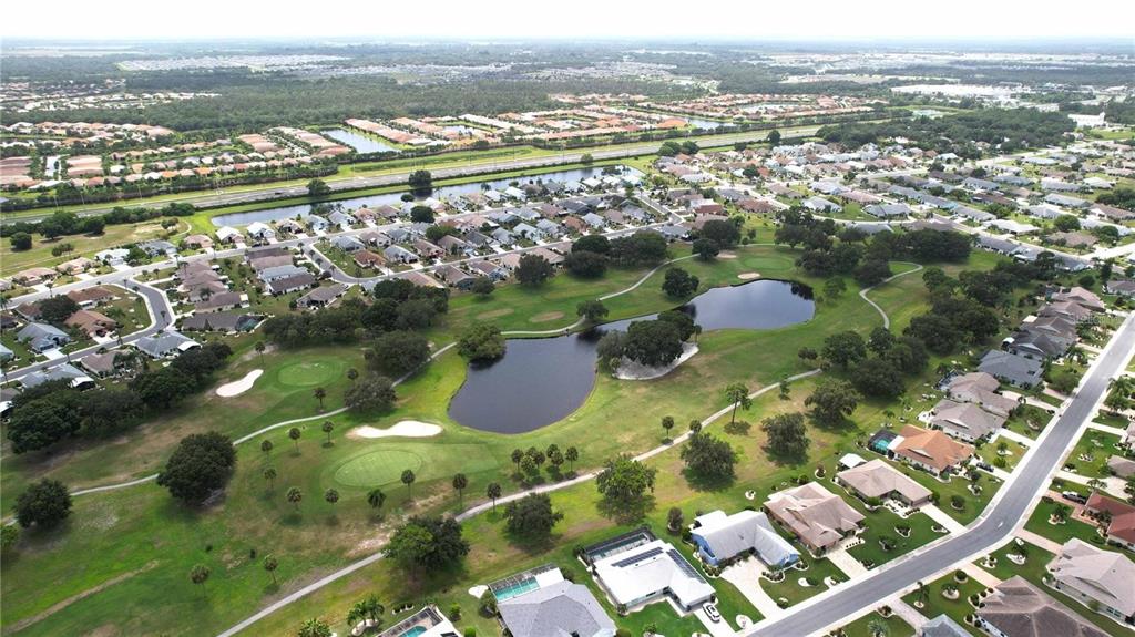 1820 El Rancho Drive Sun City Center, FL 33573 - Photo 15 of 70 an aerial view of residential houses with outdoor space