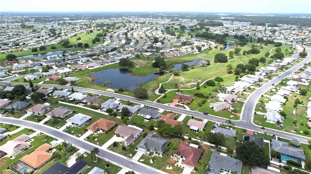 1820 El Rancho Drive Sun City Center, FL 33573 - Photo 17 of 70 an aerial view of city and lake