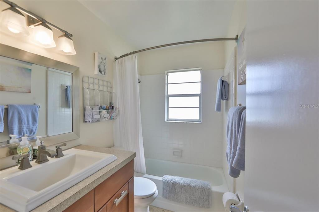 1820 El Rancho Drive Sun City Center, FL 33573 - Photo 26 of 70 a bathroom with a sink toilet and shower
