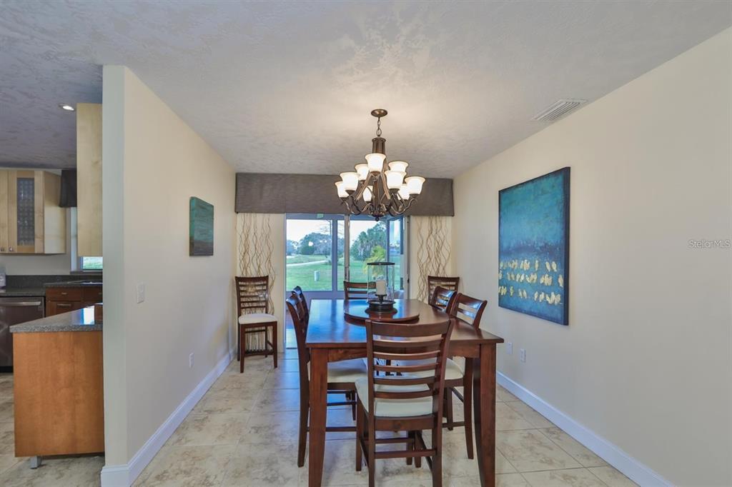 1820 El Rancho Drive Sun City Center, FL 33573 - Photo 33 of 70 a view of a dining room with furniture window and outside view