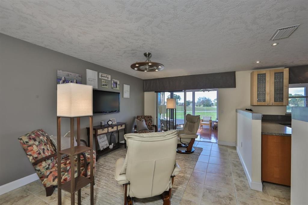 1820 El Rancho Drive Sun City Center, FL 33573 - Photo 43 of 70 a living room with furniture and a window
