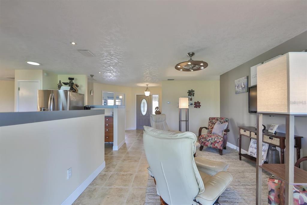 1820 El Rancho Drive Sun City Center, FL 33573 - Photo 44 of 70 a living room with furniture and a table