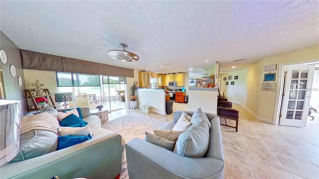 1820 El Rancho Drive Sun City Center, FL 33573 - Photo 5 of 70 a living room with furniture and wooden floor