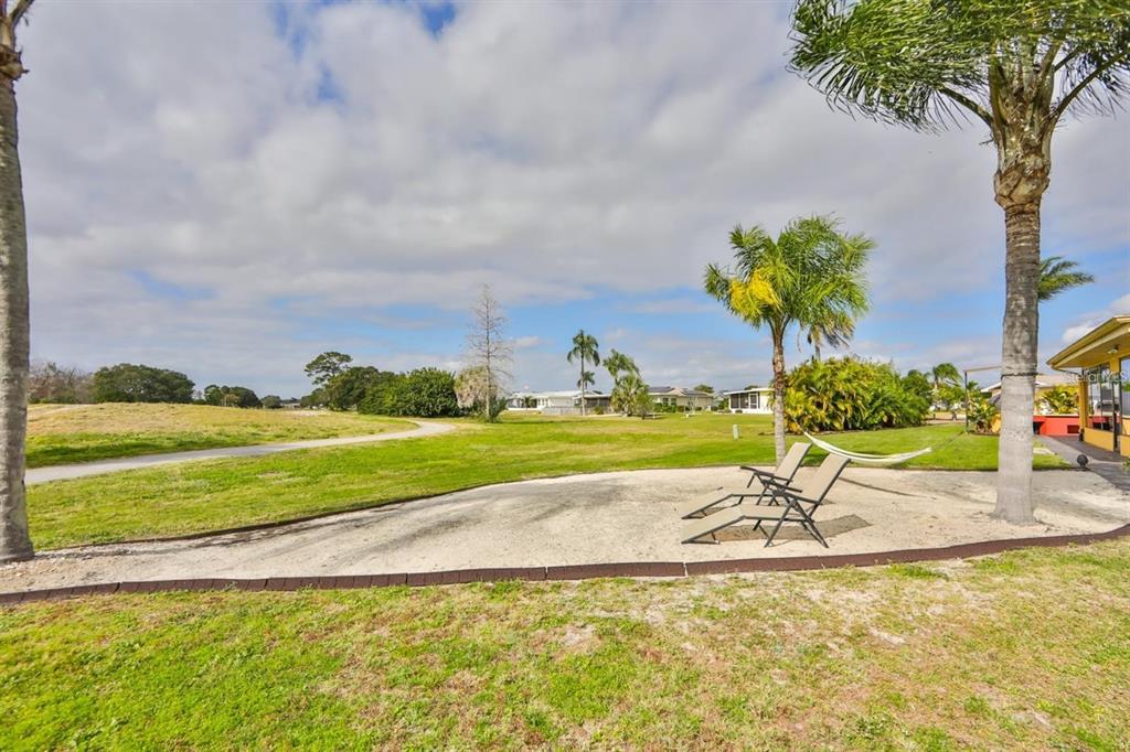 1820 El Rancho Drive Sun City Center, FL 33573 - Photo 55 of 70 a view of a swimming pool with a yard