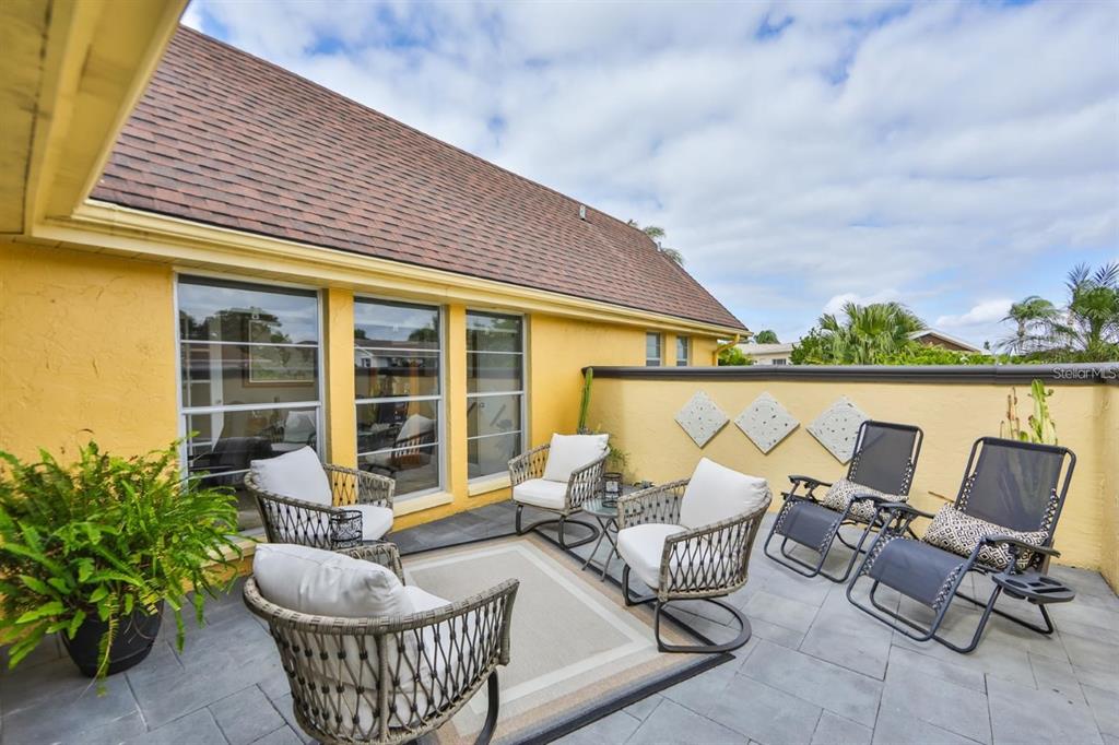 1820 El Rancho Drive Sun City Center, FL 33573 - Photo 64 of 70 an outdoor sitting area with furniture and garden