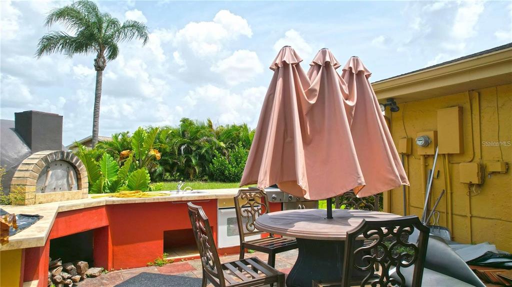 1820 El Rancho Drive Sun City Center, FL 33573 - Photo 9 of 70 a view of a chairs and table in patio