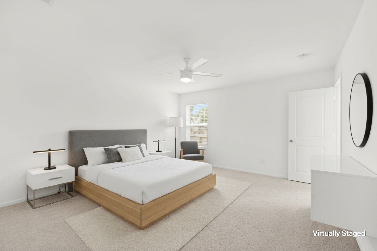 252 Houston Street Angleton, TX 77515 - Photo 26 of 49 Virtually staged bedroom showcases a spacious footprint with neutral carpeting, ceiling fan, window for natural light, and room for additional furnishings.