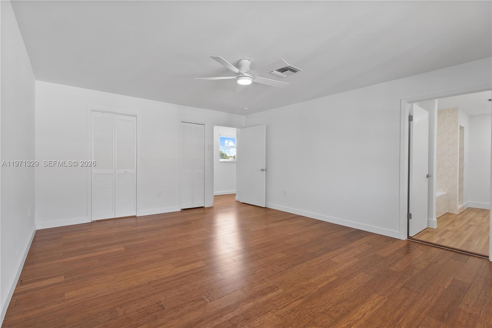2870 Southwest 21st Street Miami, FL 33145 - Photo 14 of 34 a view of an empty room with wooden floor