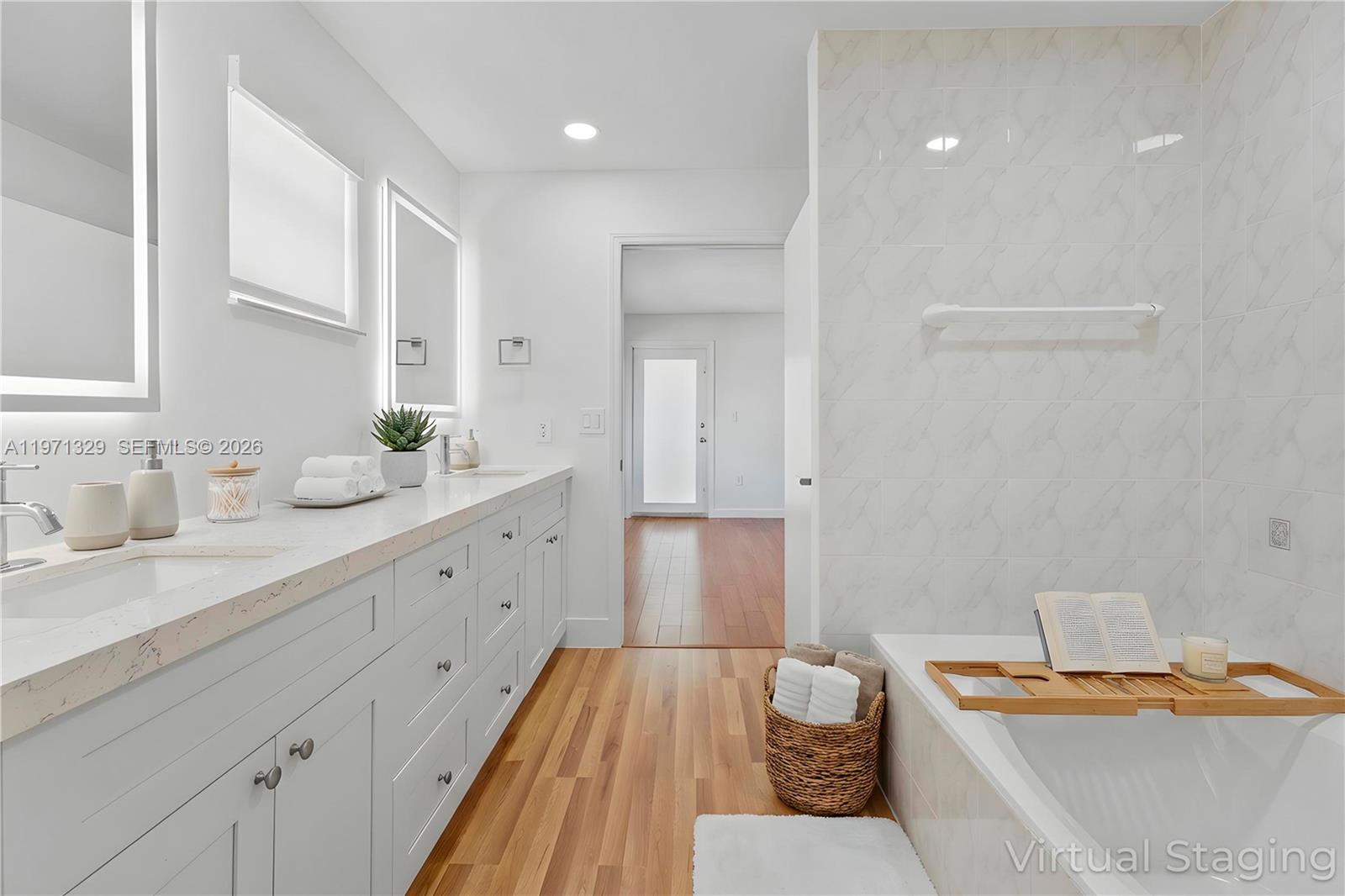 2870 Southwest 21st Street Miami, FL 33145 - Photo 15 of 34 a spacious bathroom with a granite countertop sink and a mirror