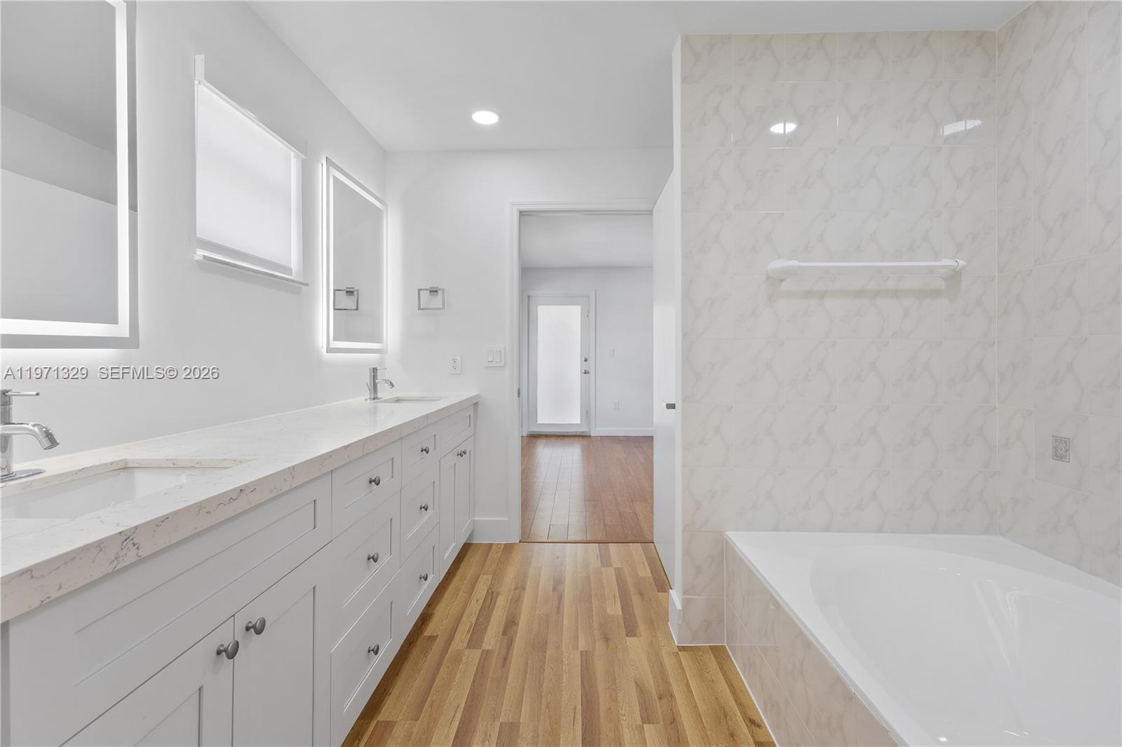 2870 Southwest 21st Street Miami, FL 33145 - Photo 16 of 34 a spacious bathroom with a tub sink and mirror