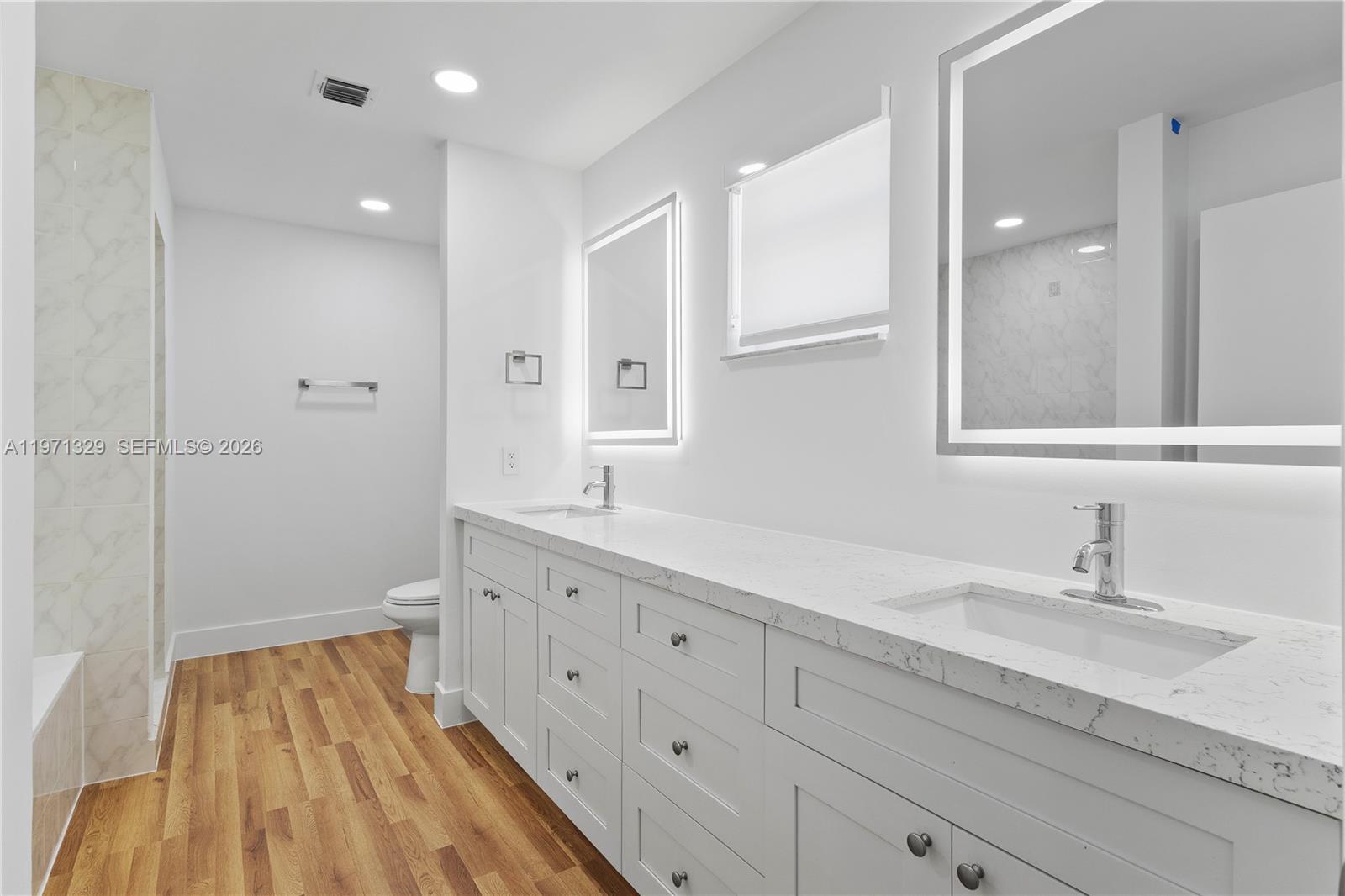 2870 Southwest 21st Street Miami, FL 33145 - Photo 17 of 34 a spacious bathroom with a double vanity sink and mirror