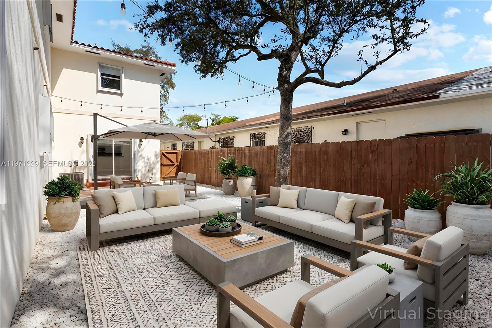 2870 Southwest 21st Street Miami, FL 33145 - Photo 28 of 34 a patio with patio a couch and potted plants