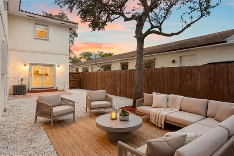 a outdoor living space with furniture and a potted plant