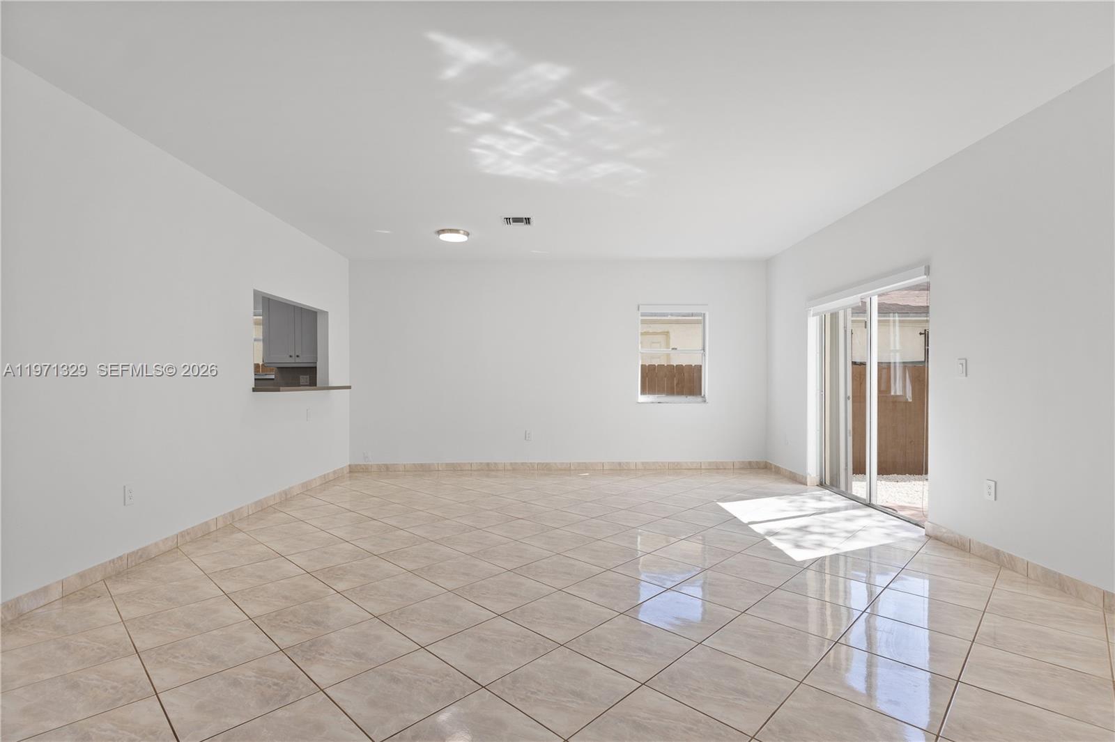 2870 Southwest 21st Street Miami, FL 33145 - Photo 3 of 34 a view of an empty room and window