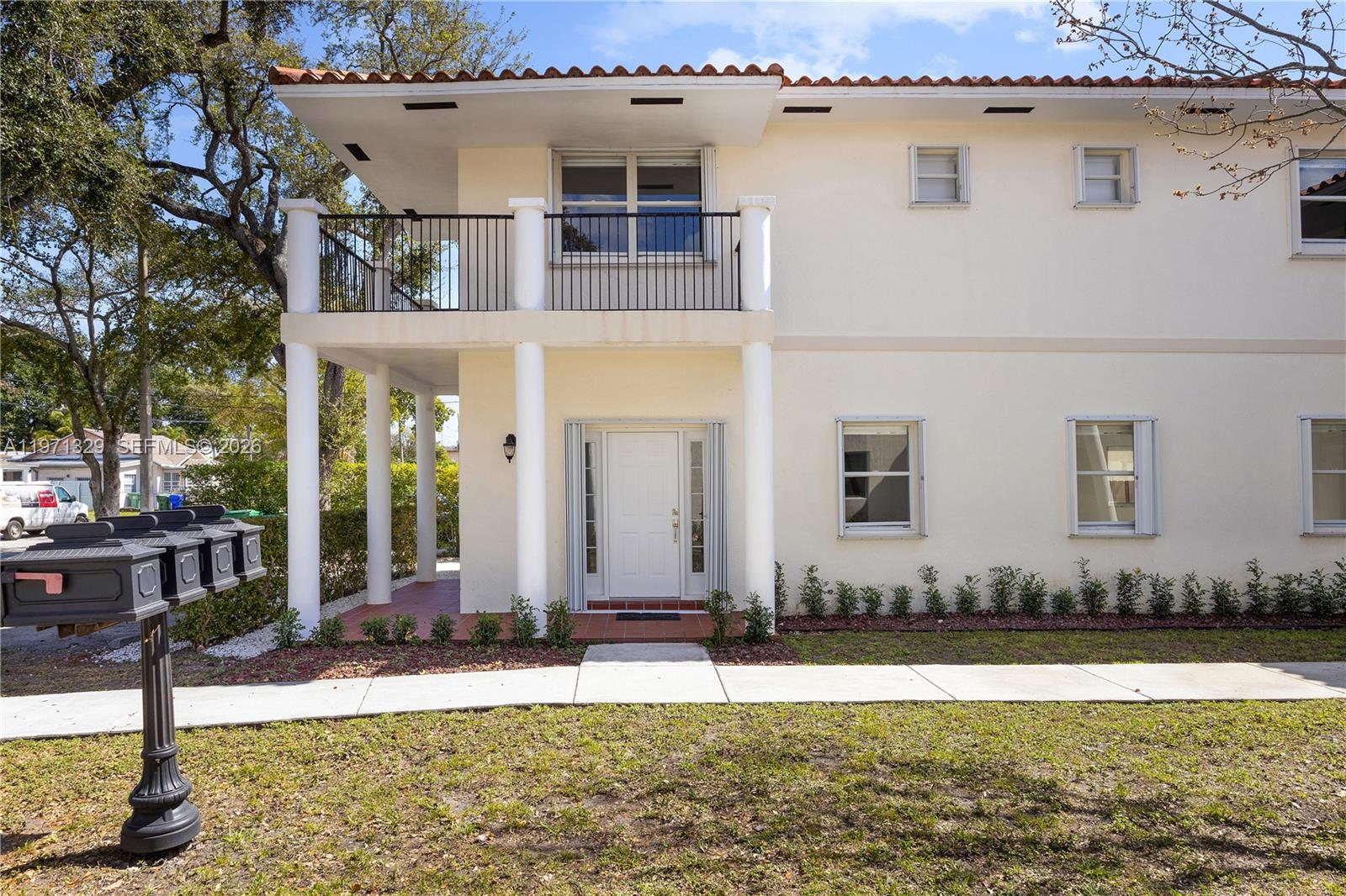 2870 Southwest 21st Street Miami, FL 33145 - Photo 33 of 34 a front view of a house with a yard
