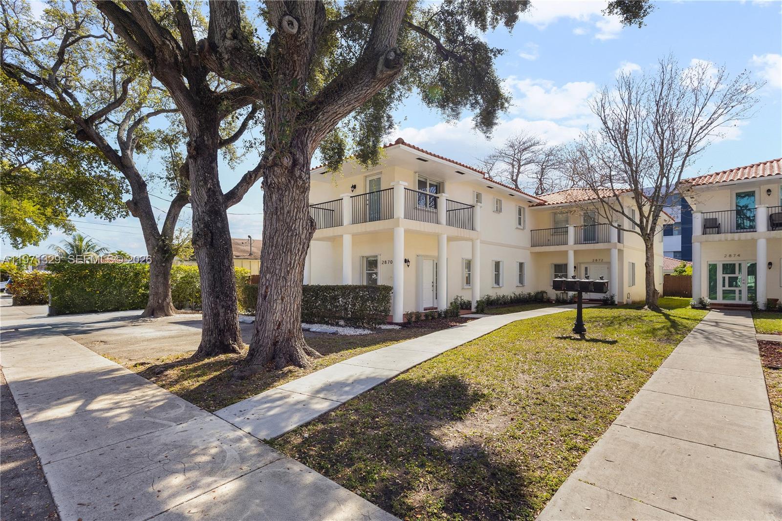 2870 Southwest 21st Street Miami, FL 33145 - Photo 34 of 34 a view of a white house with a yard