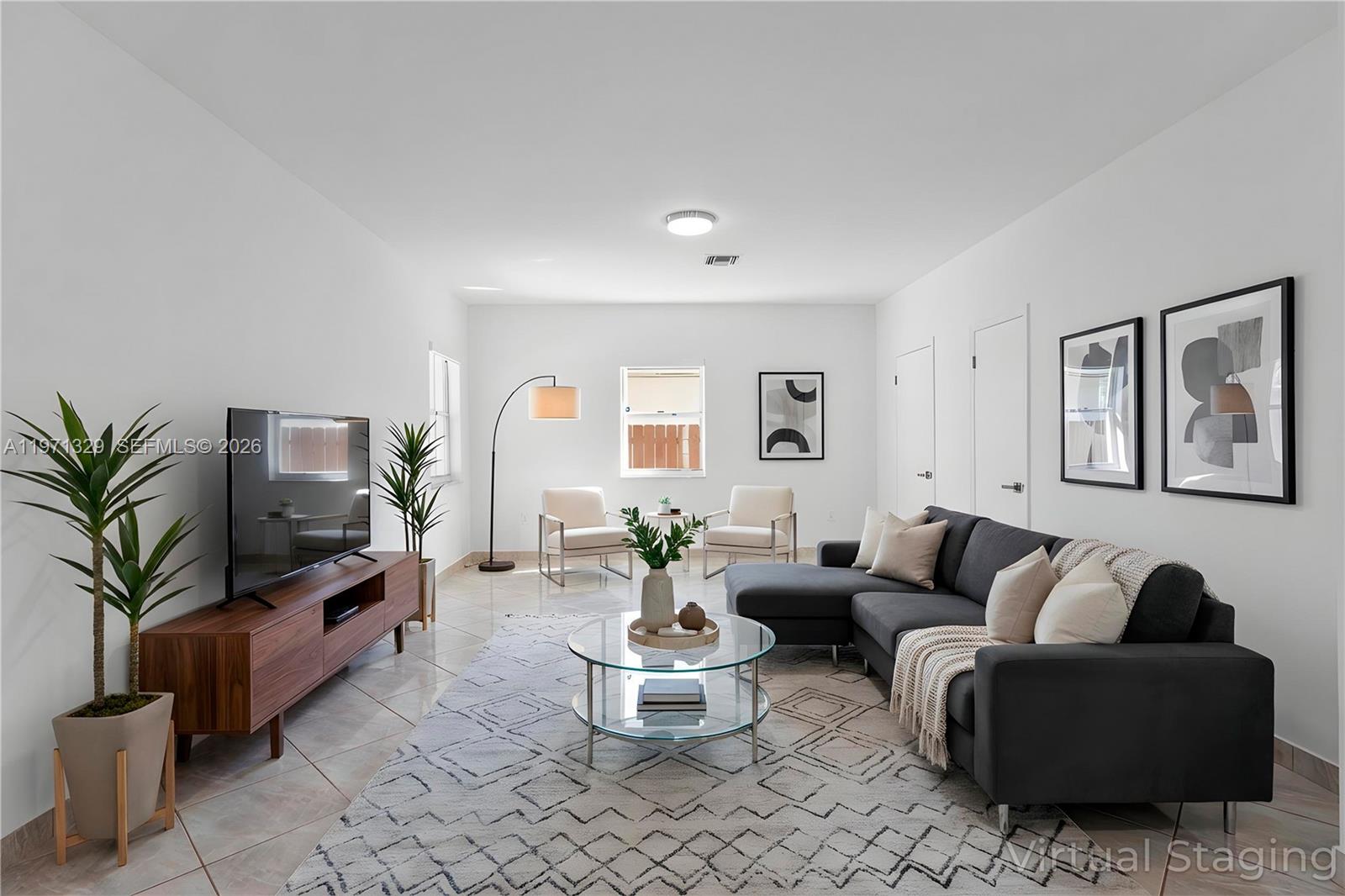 2870 Southwest 21st Street Miami, FL 33145 - Photo 4 of 34 a living room with furniture and a potted plant