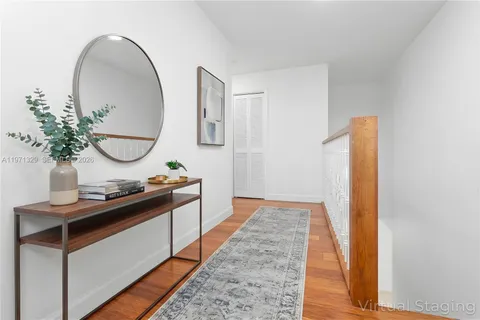 a view of a bathroom with a sink and mirror