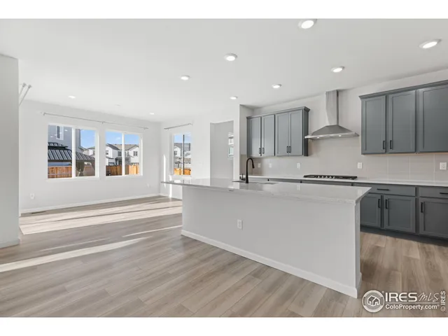 a view of kitchen with wooden floor