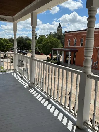 a view of a street from a balcony