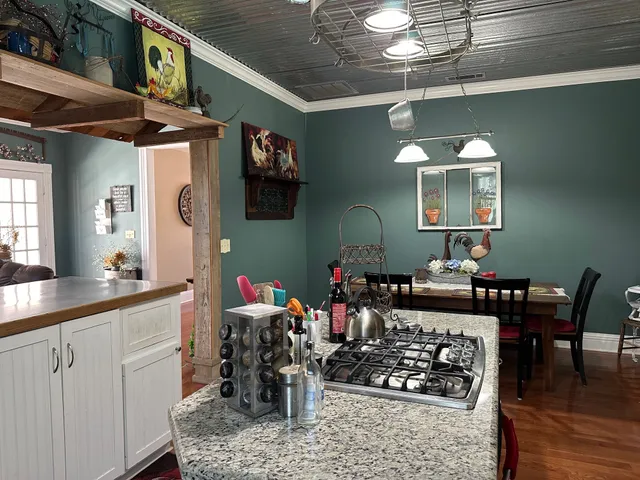a kitchen with a table and chairs in it