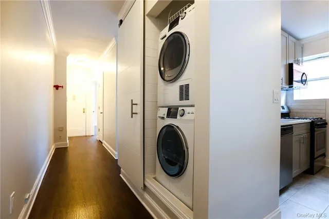 a view of a hallway with washer and dryer