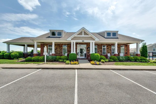 front view of a house with a small yard