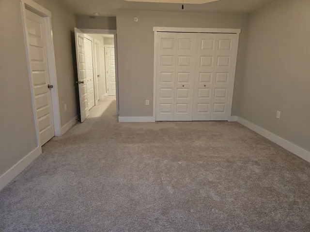 an empty room with closet area