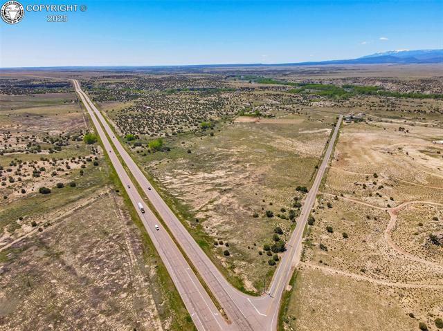 Tbd R Street Penrose, CO 81240 - Photo 8 of 15 Aerial view of sparsely populated area featuring a major roadway and mountains