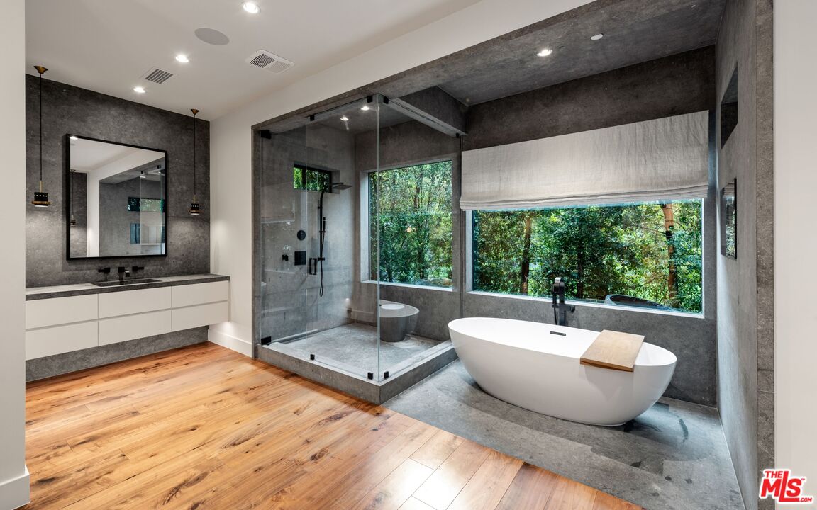 24848 Long Valley Road Hidden Hills, CA 91302 - Photo 12 of 38 a spacious bathroom with a large tub and shower