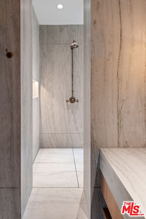 24848 Long Valley Road Hidden Hills, CA 91302 - Photo 14 of 38 a bathroom with a shower and a sink