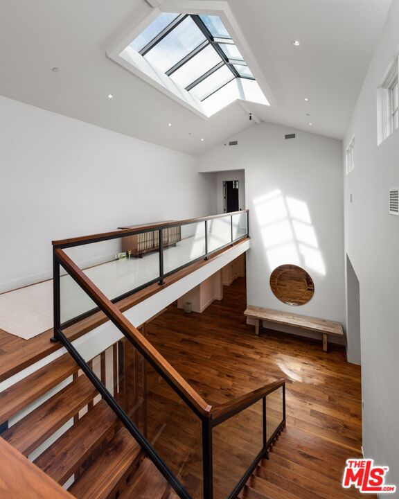 24848 Long Valley Road Hidden Hills, CA 91302 - Photo 15 of 38 a living room with wooden floor and pool table