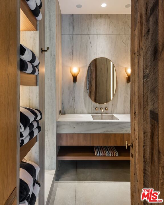 24848 Long Valley Road Hidden Hills, CA 91302 - Photo 18 of 38 a bathroom with a sink and a mirror