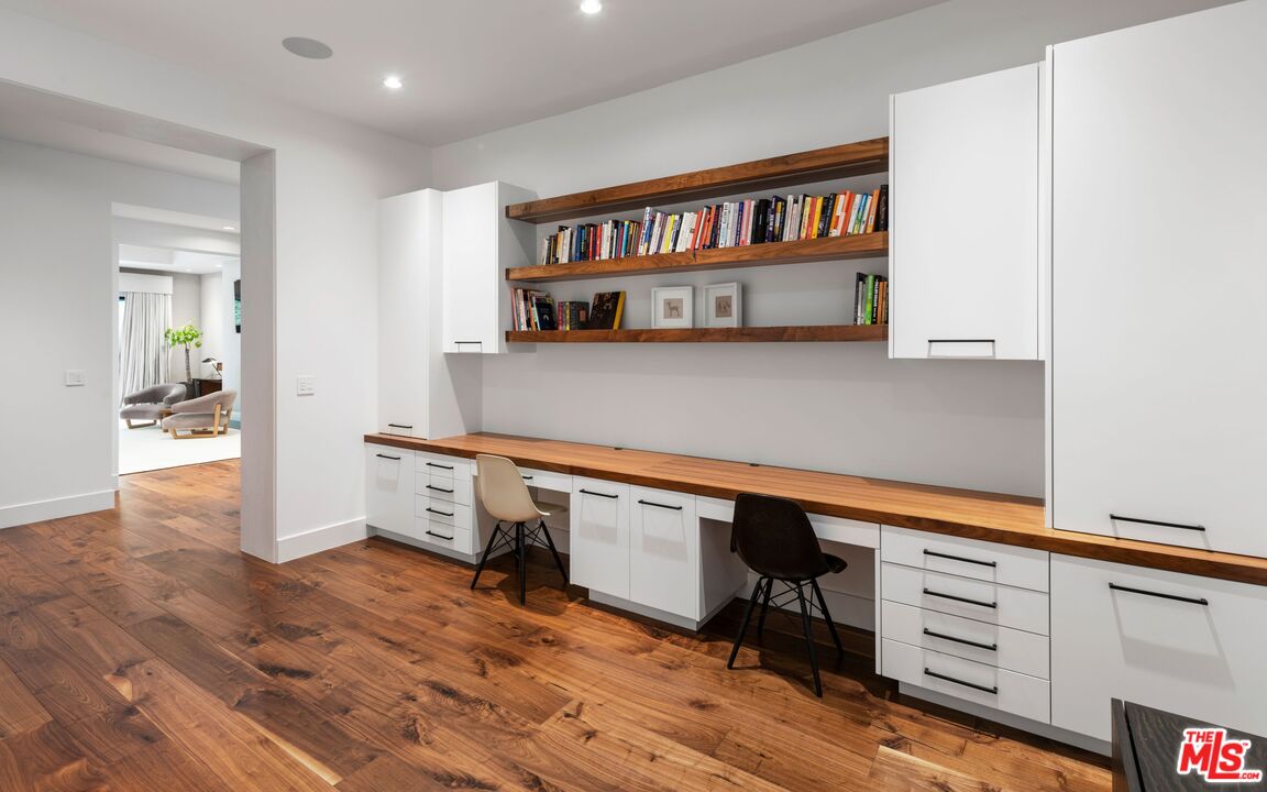 24848 Long Valley Road Hidden Hills, CA 91302 - Photo 20 of 38 a kitchen with stainless steel appliances cabinets and a wooden floor