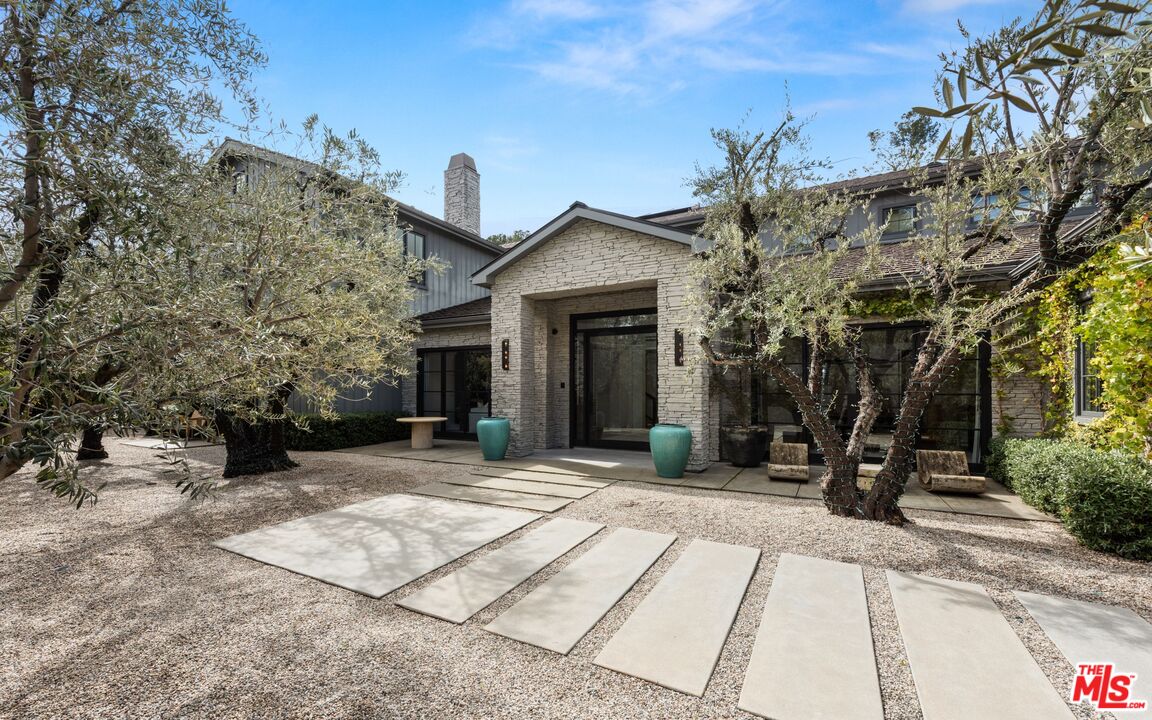 24848 Long Valley Road Hidden Hills, CA 91302 - Photo 2 of 38 a front view of a building with trees