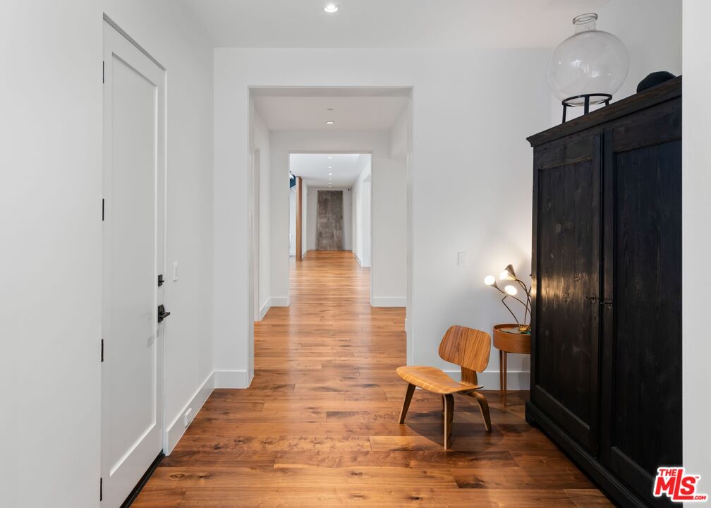 24848 Long Valley Road Hidden Hills, CA 91302 - Photo 22 of 38 a view of a room with wooden floor and a bathroom