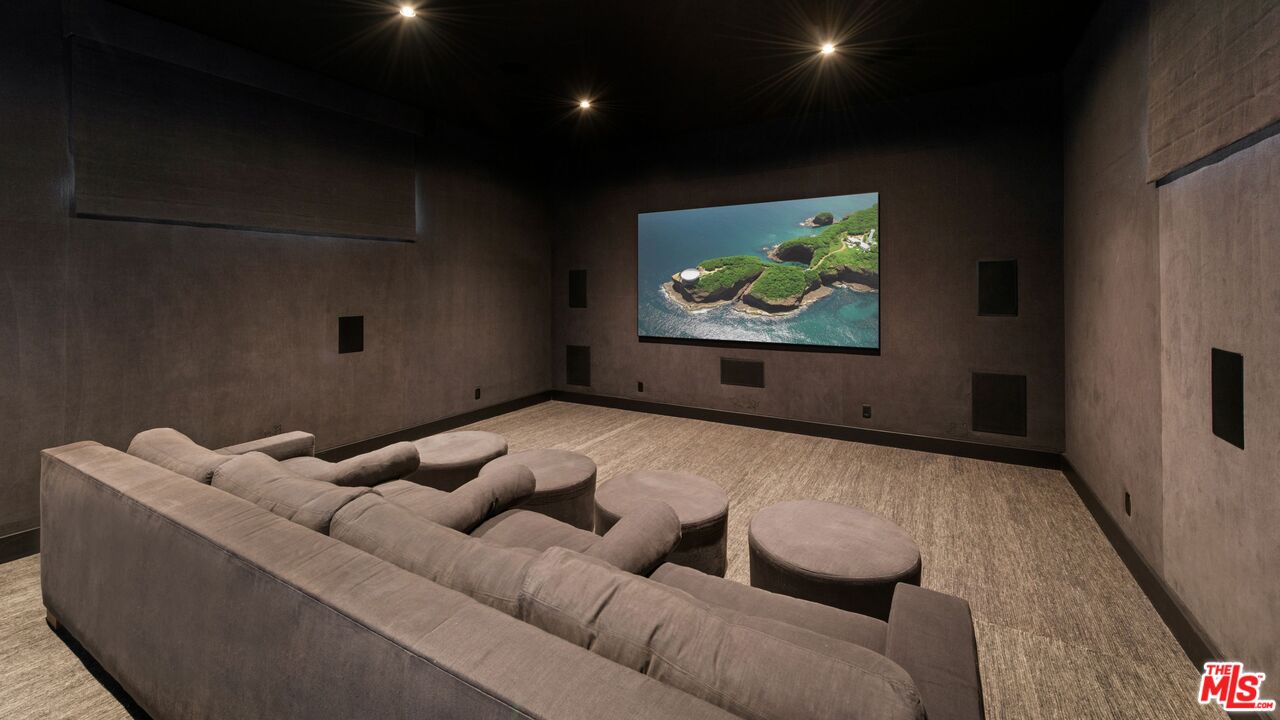 24848 Long Valley Road Hidden Hills, CA 91302 - Photo 26 of 38 a living room with furniture and a flat screen tv