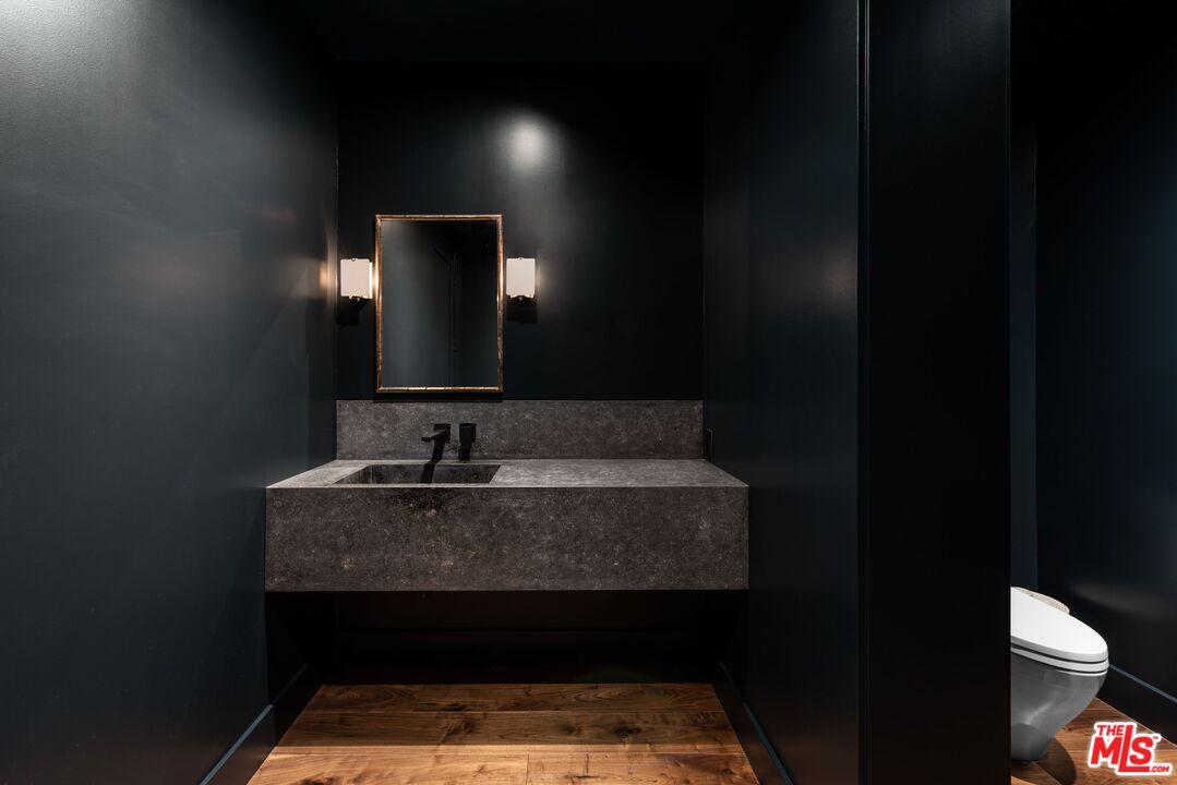 24848 Long Valley Road Hidden Hills, CA 91302 - Photo 27 of 38 a bathroom with a sink and a mirror