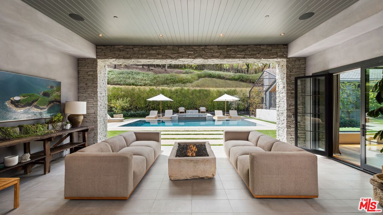 24848 Long Valley Road Hidden Hills, CA 91302 - Photo 29 of 38 a living room with furniture and a large window
