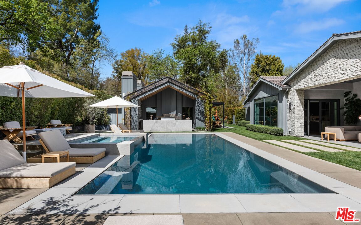 24848 Long Valley Road Hidden Hills, CA 91302 - Photo 30 of 38 a house view with a garden space