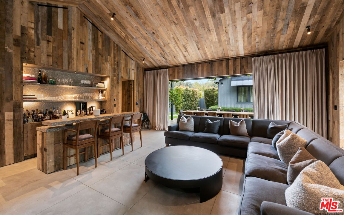 24848 Long Valley Road Hidden Hills, CA 91302 - Photo 36 of 38 a living room with furniture and a large window