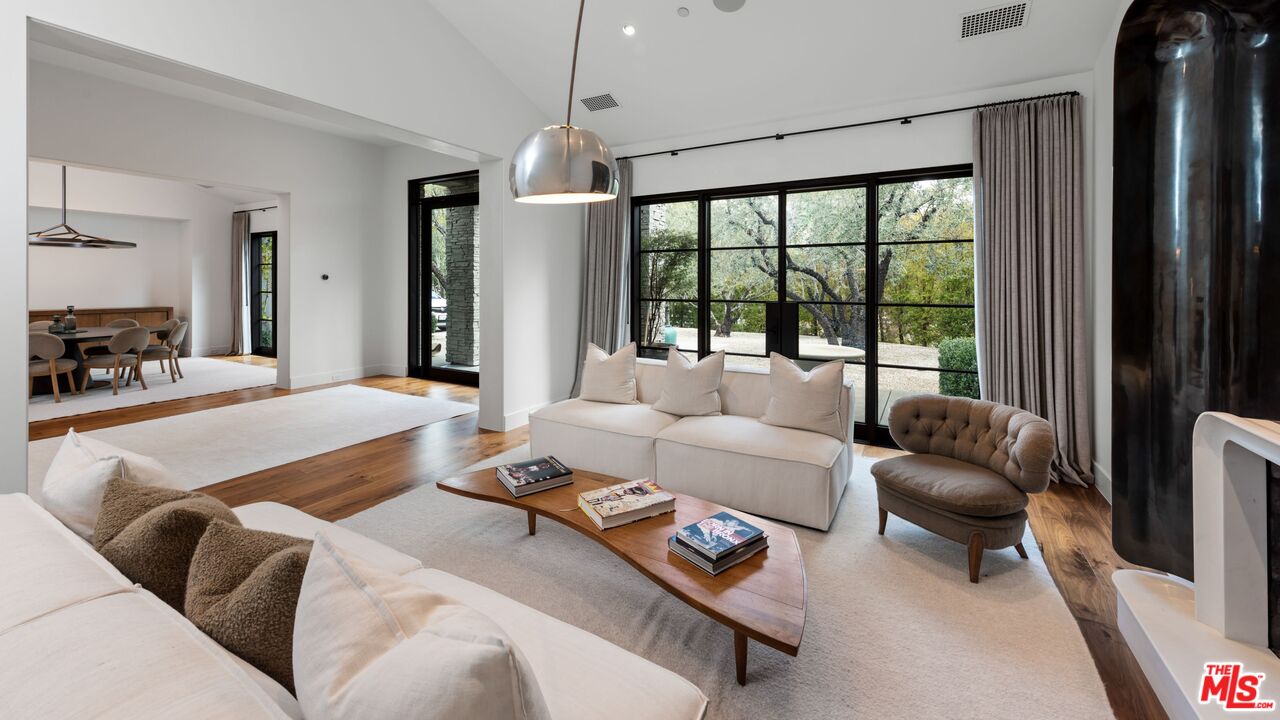 24848 Long Valley Road Hidden Hills, CA 91302 - Photo 4 of 38 a bedroom with furniture and a large window