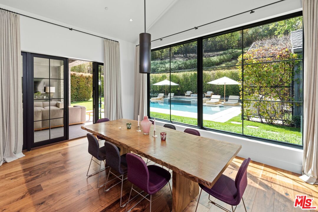 24848 Long Valley Road Hidden Hills, CA 91302 - Photo 6 of 38 a view of a dining room with furniture window and wooden floor