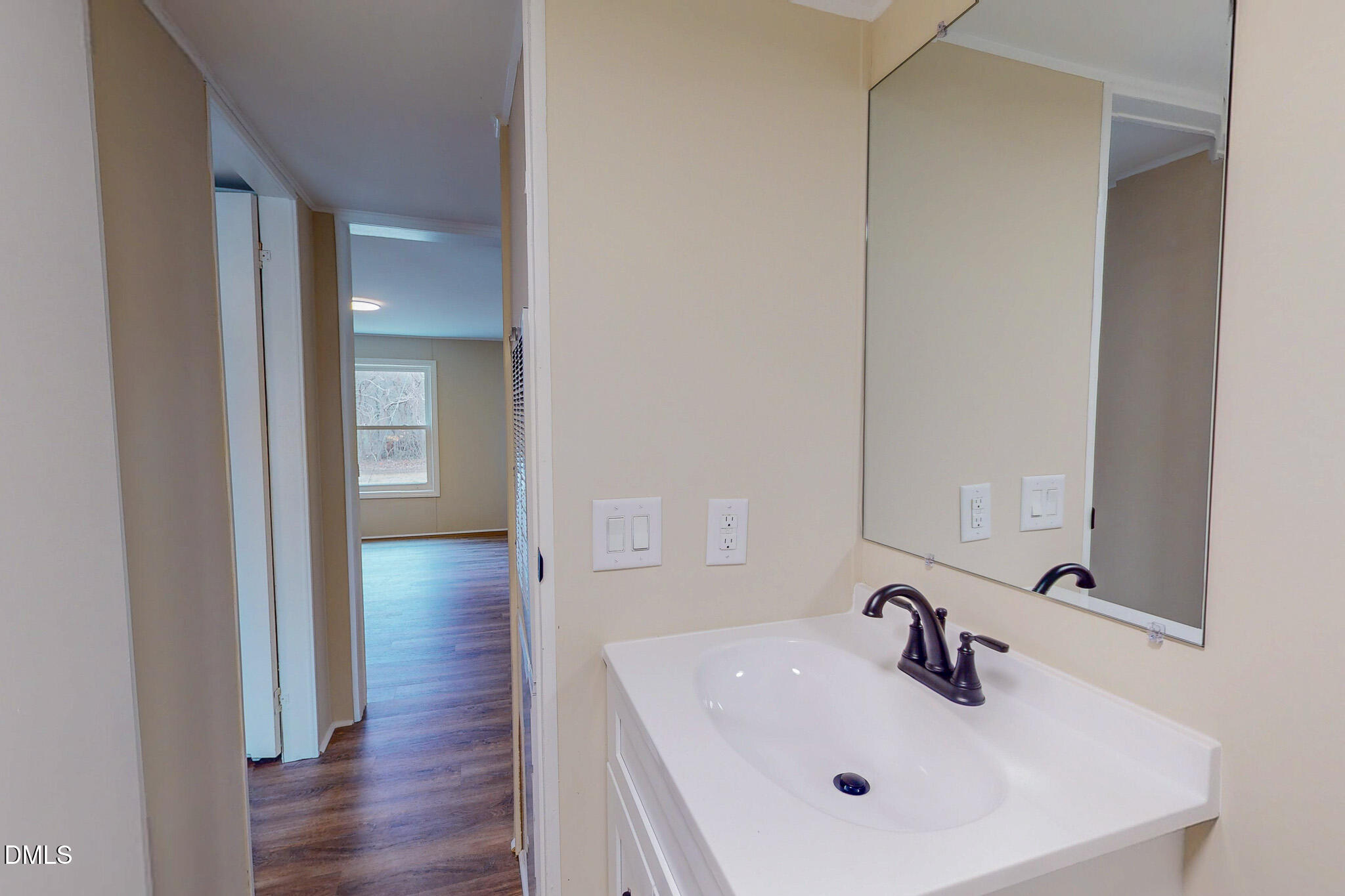 67 Halifax Road Roxboro, NC 27574 - Photo 43 of 48 a bathroom with a sink and a mirror