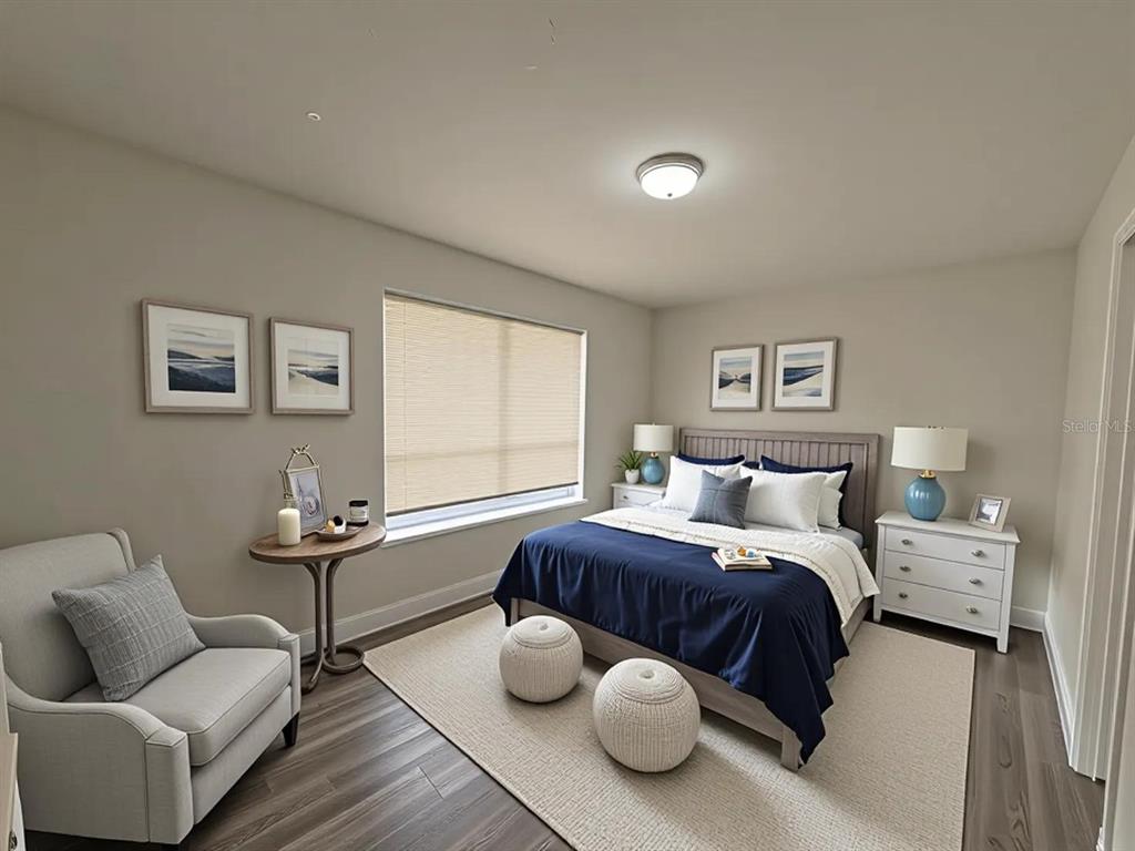 4033 Henley Road, Unit 1707 Orlando, FL 32839 - Photo 12 of 66 a bedroom with a bed and wooden floor
