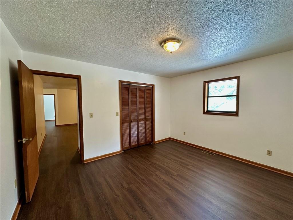 621 Nicklesville Road Northeast Resaca, GA 30735 - Photo 14 of 24 an empty room with wooden floor and windows