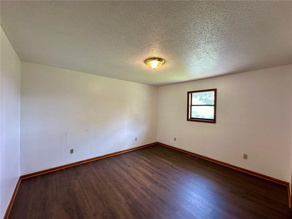 621 Nicklesville Road Northeast Resaca, GA 30735 - Photo 15 of 24 a view of an empty room with wooden floor and a window