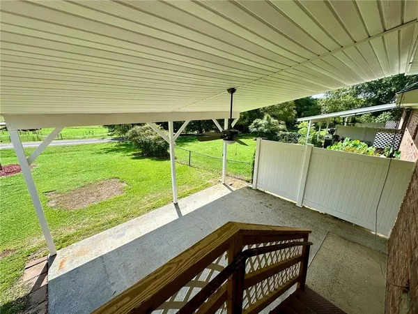 a view of a backyard with sitting area